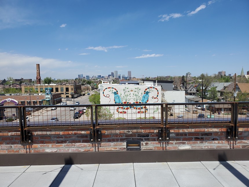 the Denver skyline with a mural in the foreground