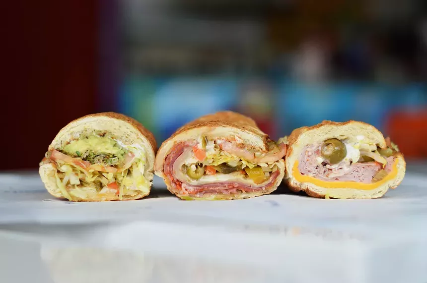 three sandwiches cut in half