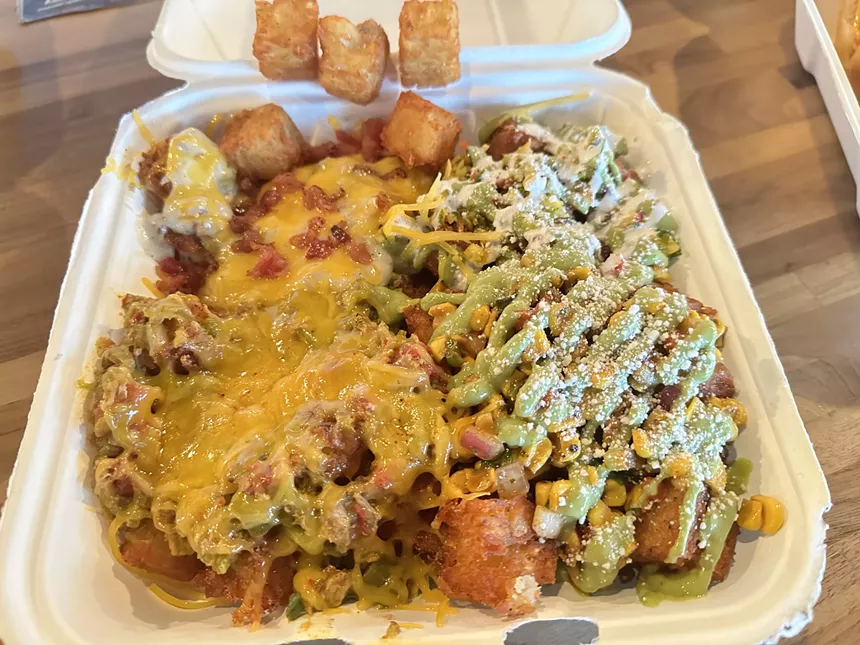 smothered tots in a to-go box
