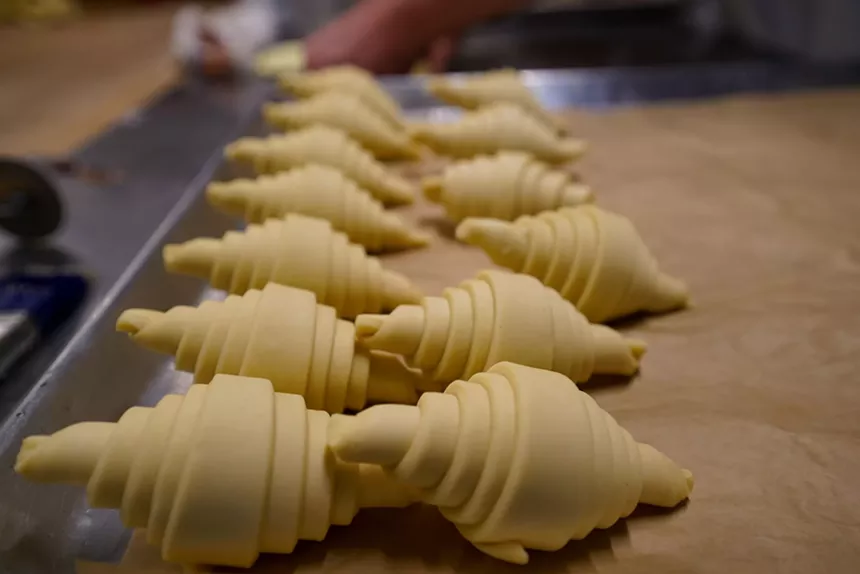 croissants on a pan before being baked