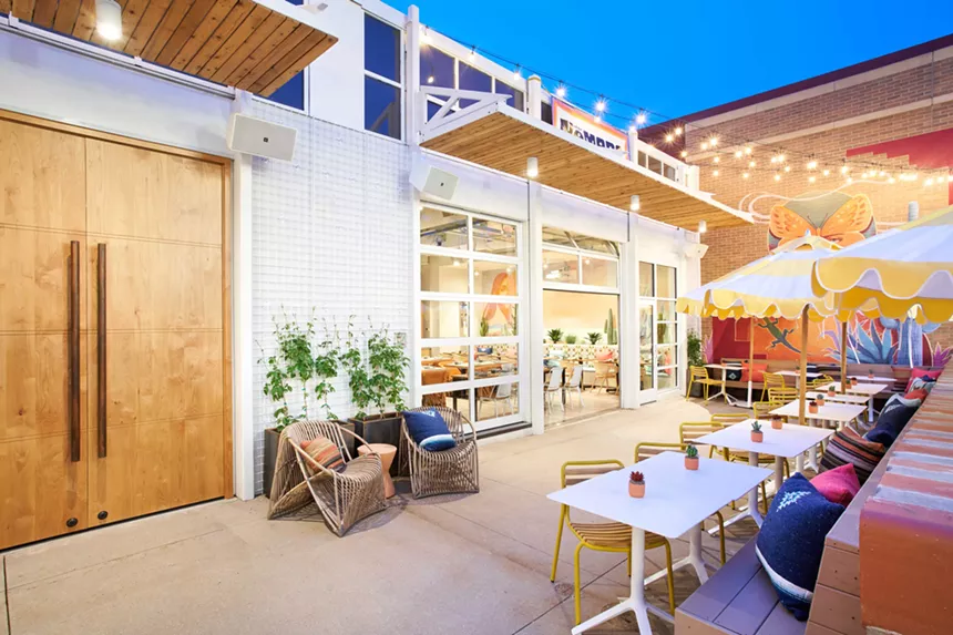 the patio of  restaurant with lights and tables