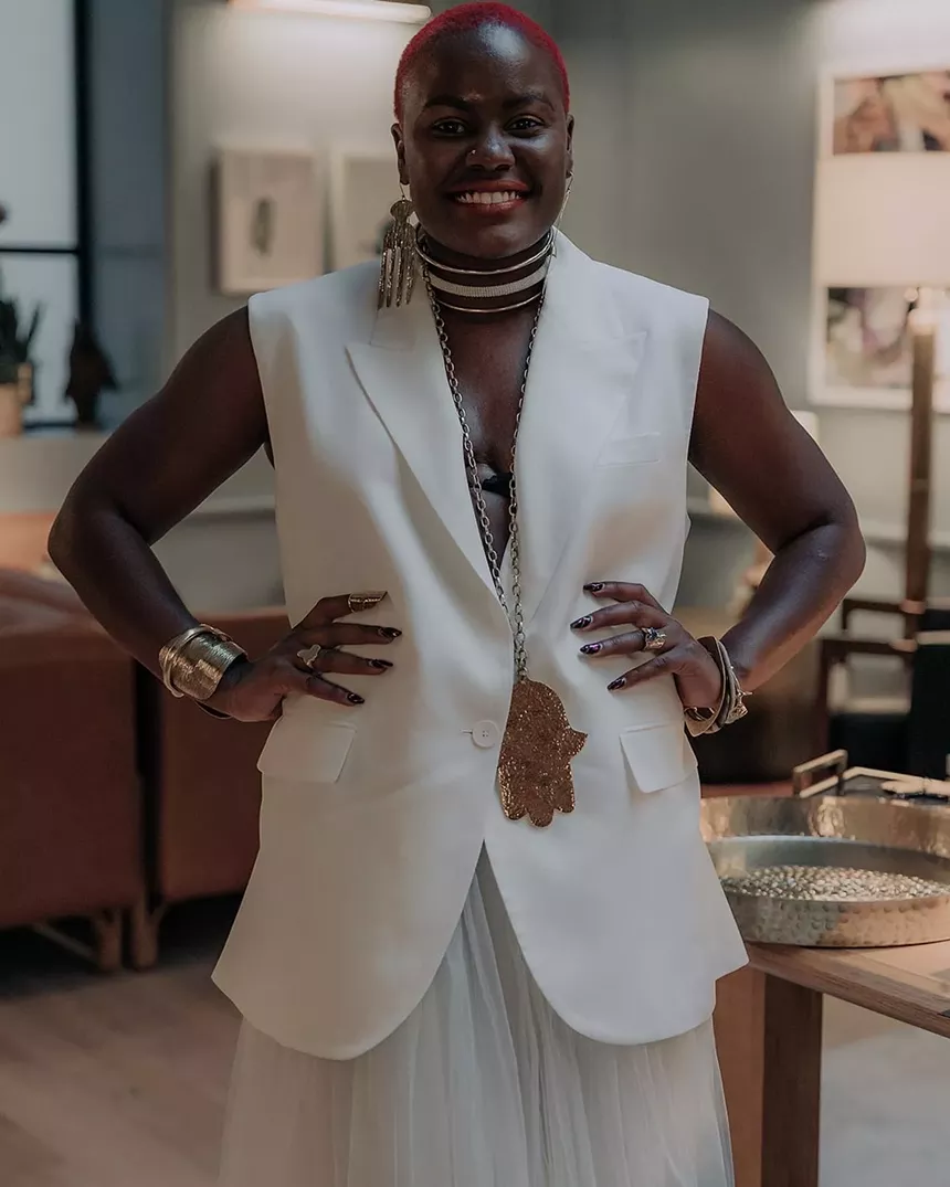 african woman in white suit