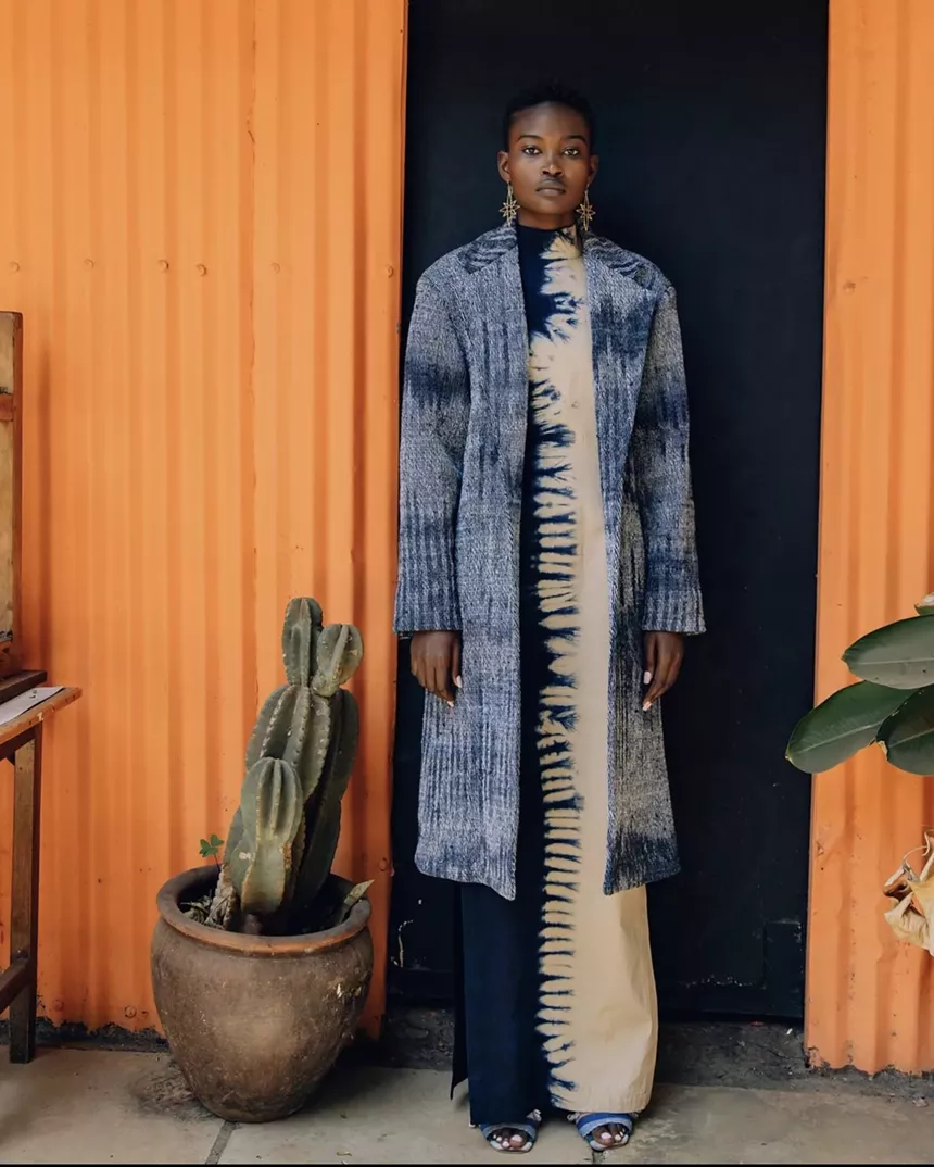 a woman in a blue sweater