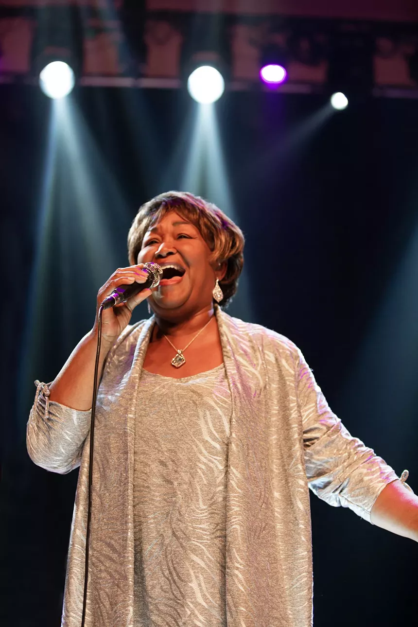 soul singer singing into microphone
