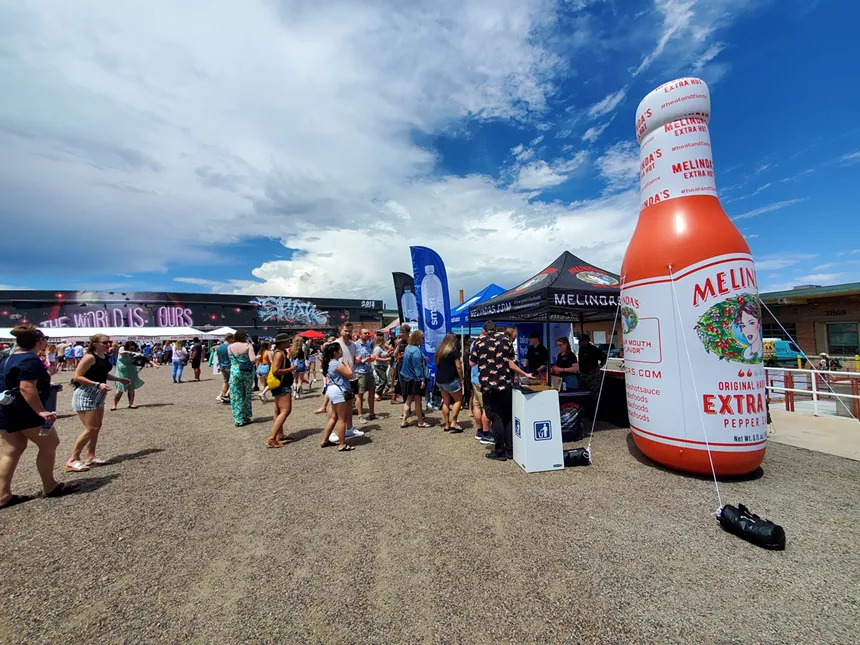 a large inflatable hot sauce bottle