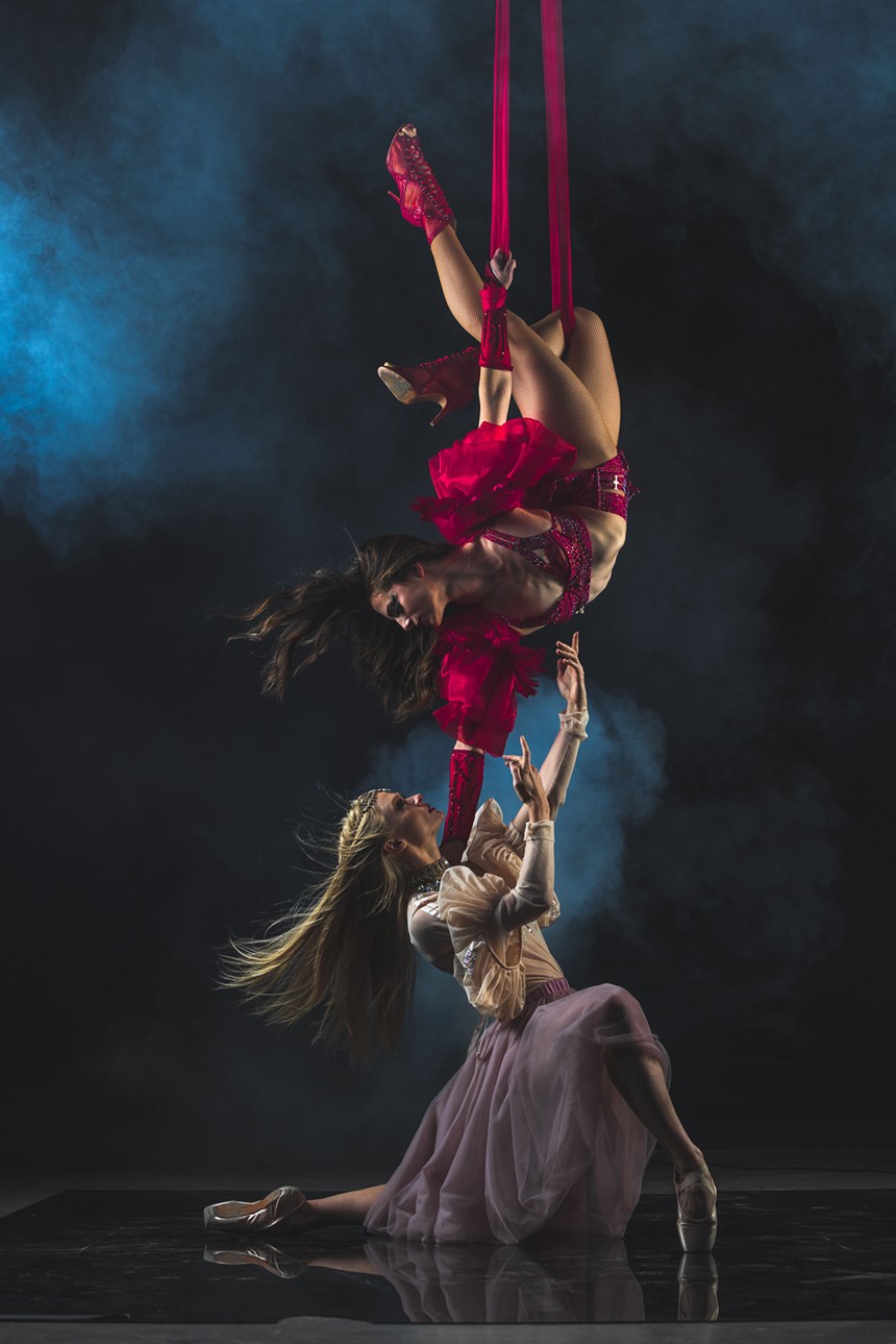 ballet dancer lifts up aerial artist