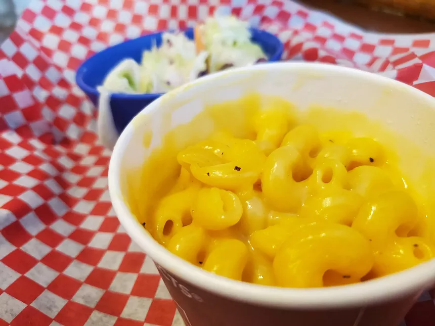 mac and cheese in a small cardboard cup