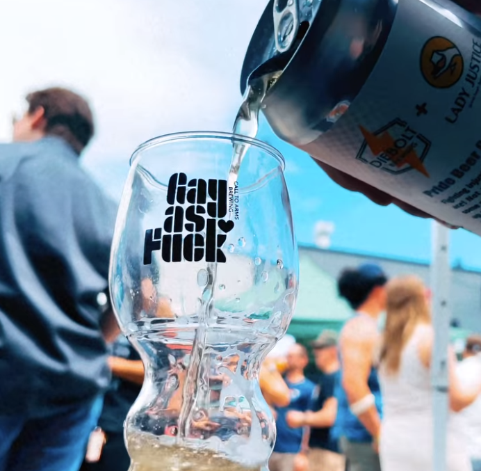 beer being poured into a glass