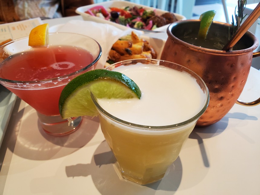 three cocktails on a table