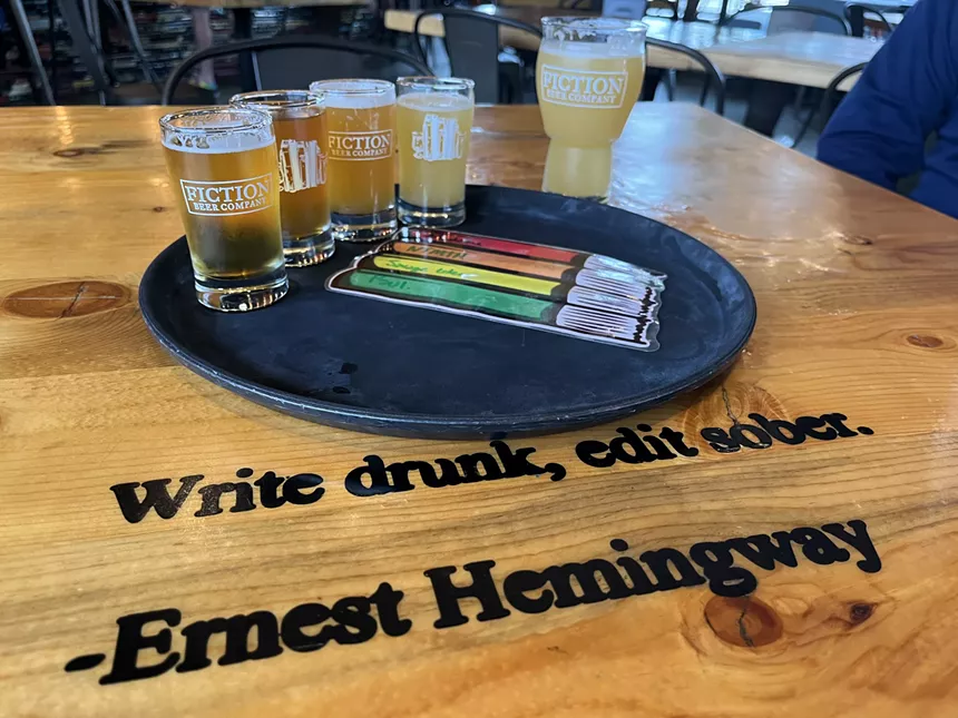 beers in glasses on a tray