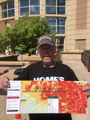 Randy Leonard showing a map of high fire danger areas in Jefferson County.