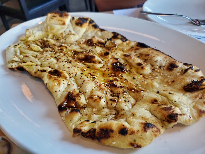 flatbread covered in spices and seeds