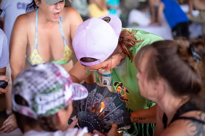 A woman smoking weed with friends