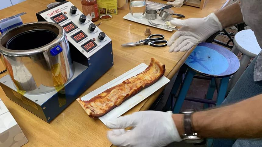 a long, rectangular pizza on a plate