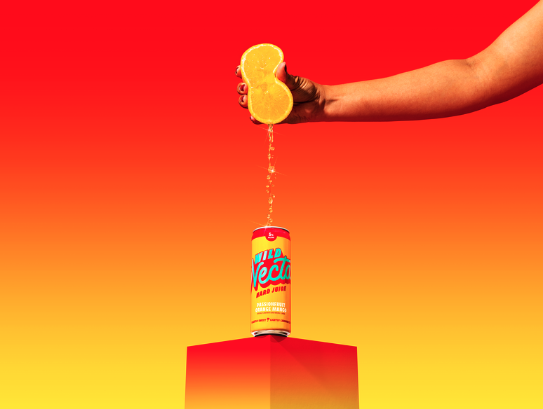hand squeezing a lemon into a can