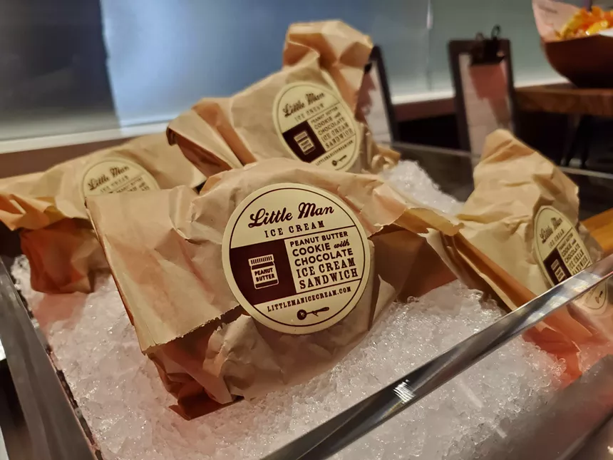 items wrapped in brown paper on ice