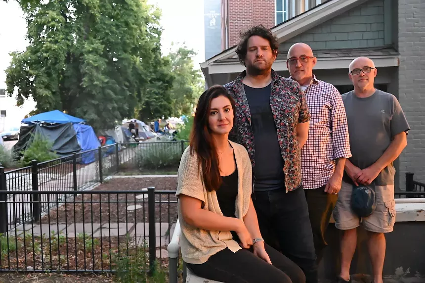 Pakizé Arslani, Kyle Tilev, James Noone and Chris O'Reilly stand on the patio of one of their High Street homes.