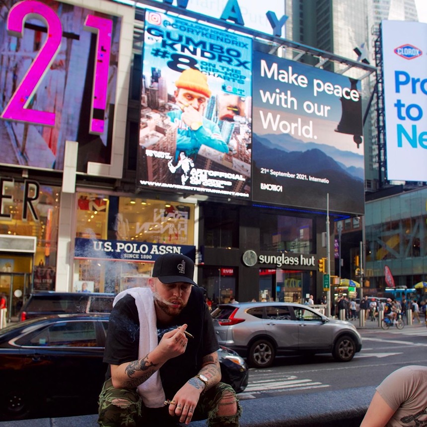 man smoking a joint in times square