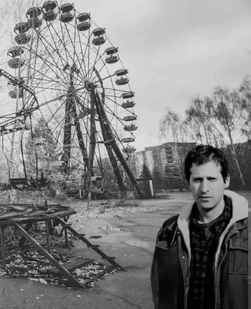 man by ferris wheel