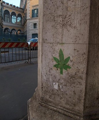 A concrete column with cannabis graffiti in Rome
