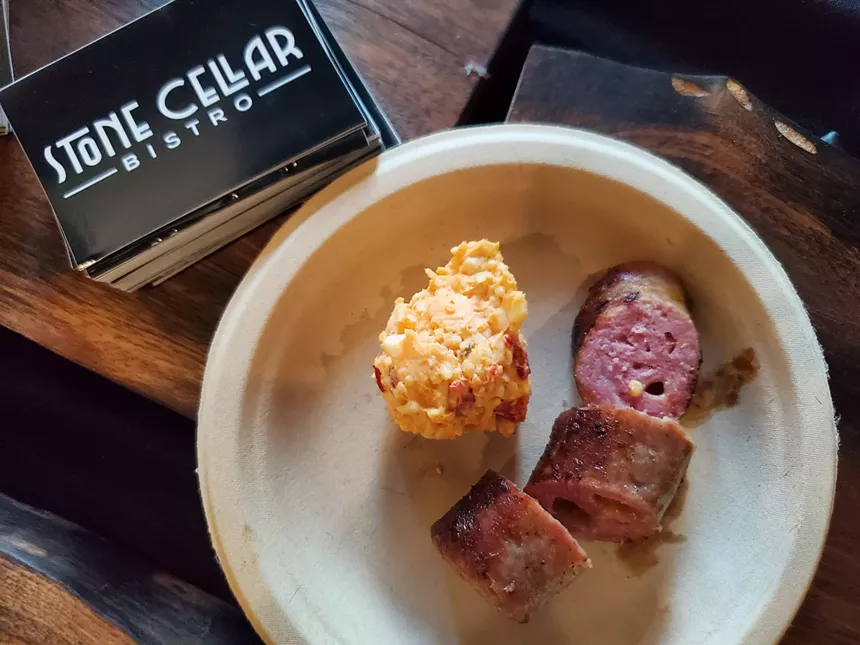 sliced sausage and a scoop of cheese