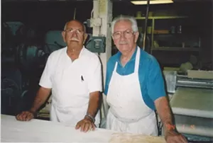 two older men in aprons