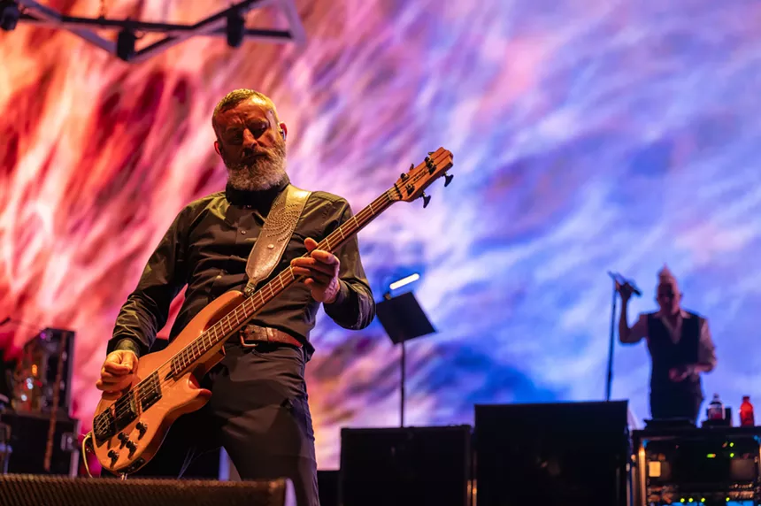 man playing bass on stage
