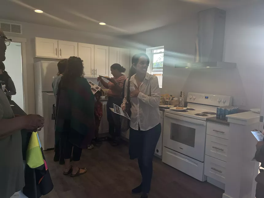 People gathered in a kitchen.