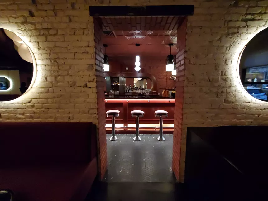 a view of bar stools through an entryway