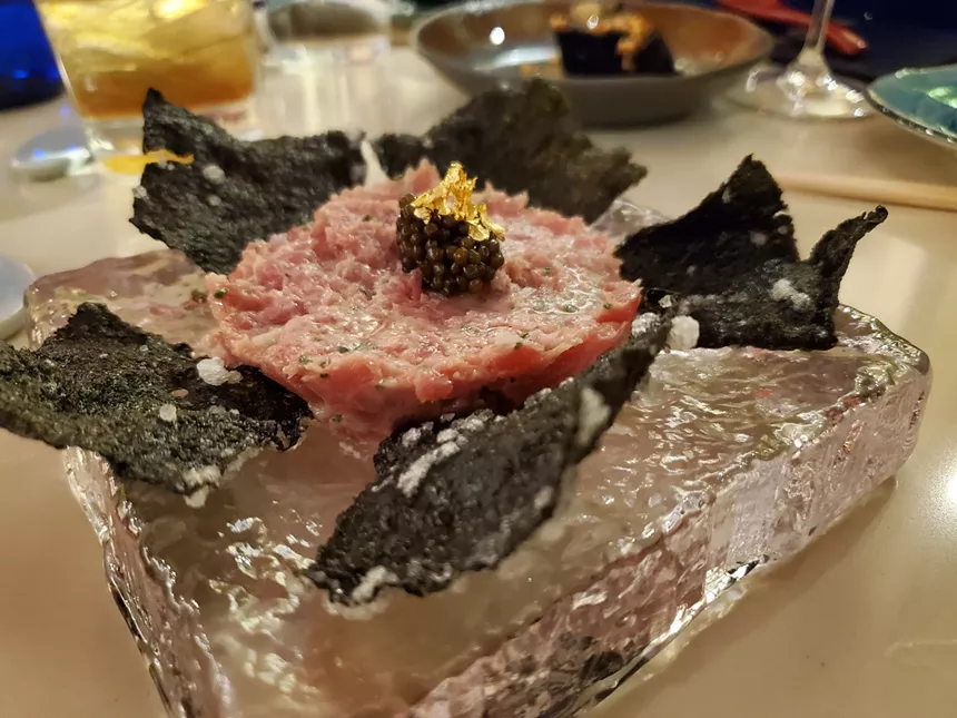 tuna tartare with seaweed chips on a plate