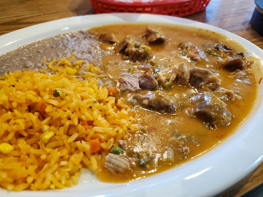 green chile, rice and beans on a plate