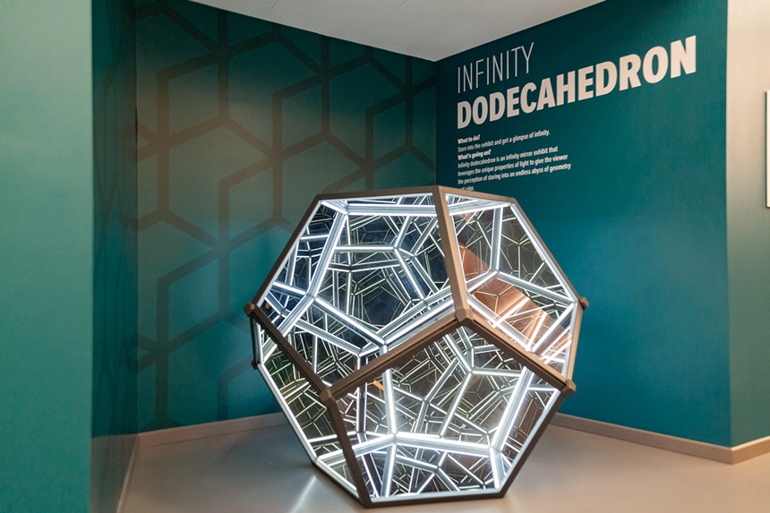 a dodecahedron sculpture with lights inside.