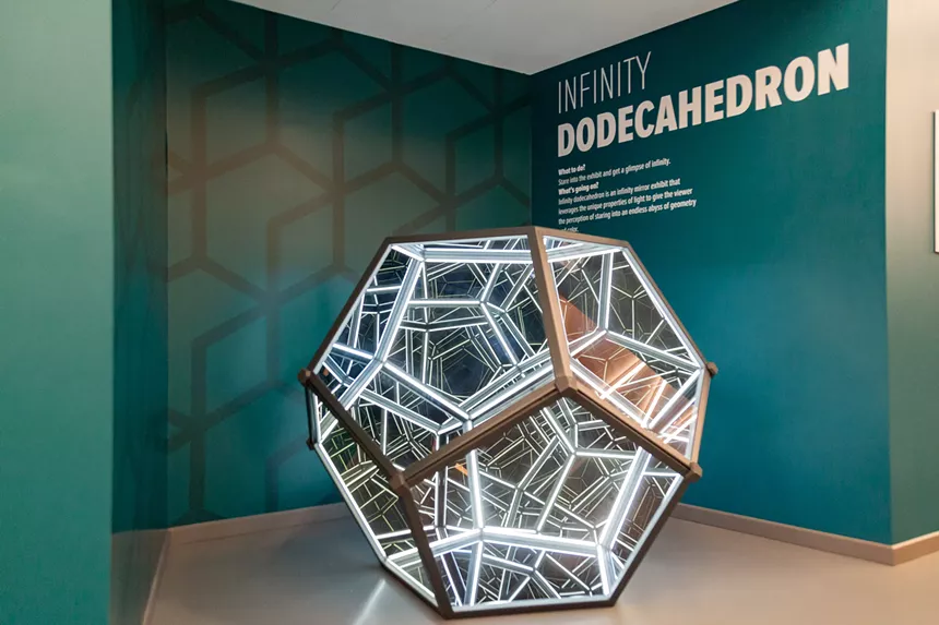 a dodecahedron sculpture with lights inside.