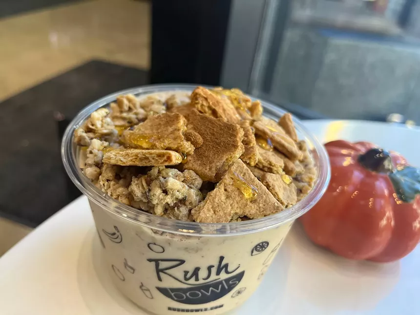 a smoothie bowl with graham crackers on top