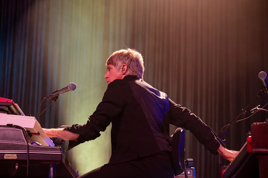 man playing piano on stage