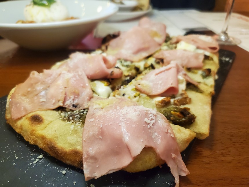 pizza topped with slices of mortadella