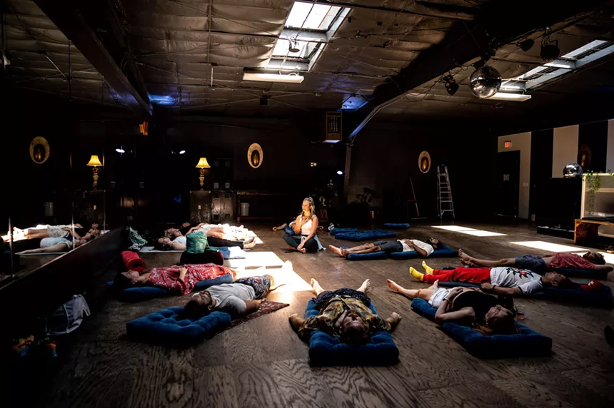 people on yoga mats in a circle