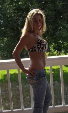 woman in bikini top and jeans