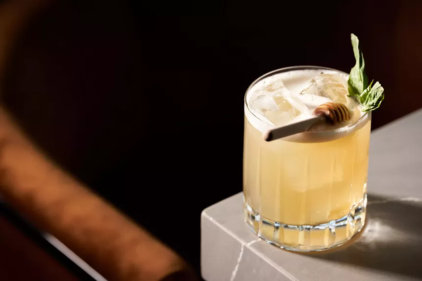 black wall with yellow cocktails