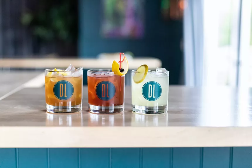 three cocktails in glasses