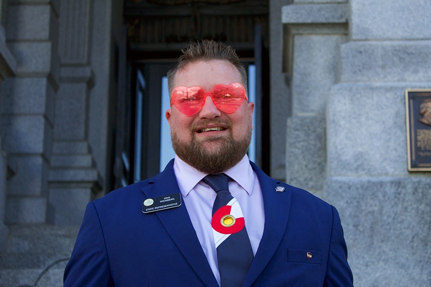 Representative Ron Weinberg wearing pink heart-shaped glasses.