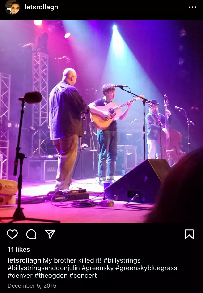 Billy Strings performing on stage.