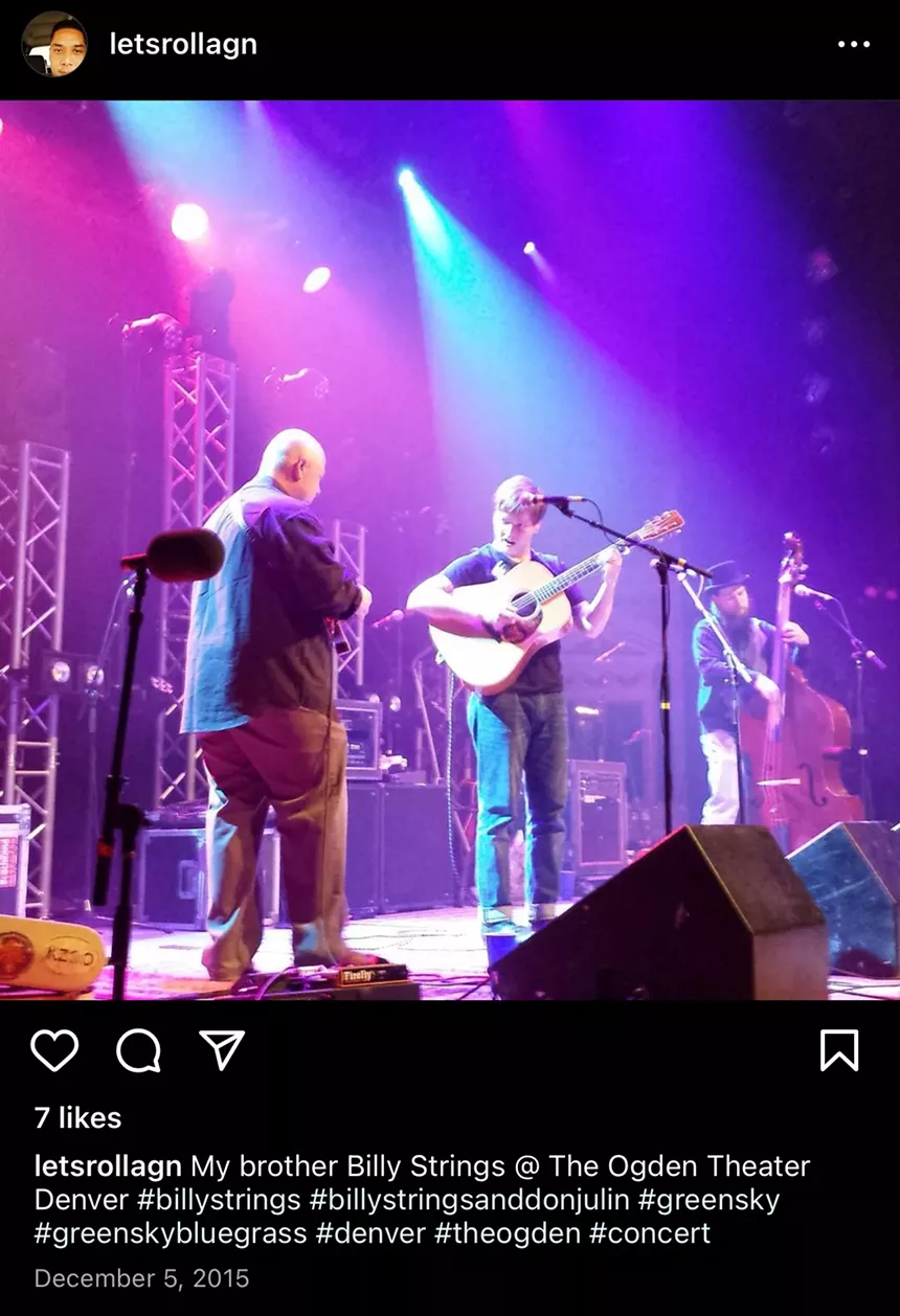 Billy Strings performing on stage.