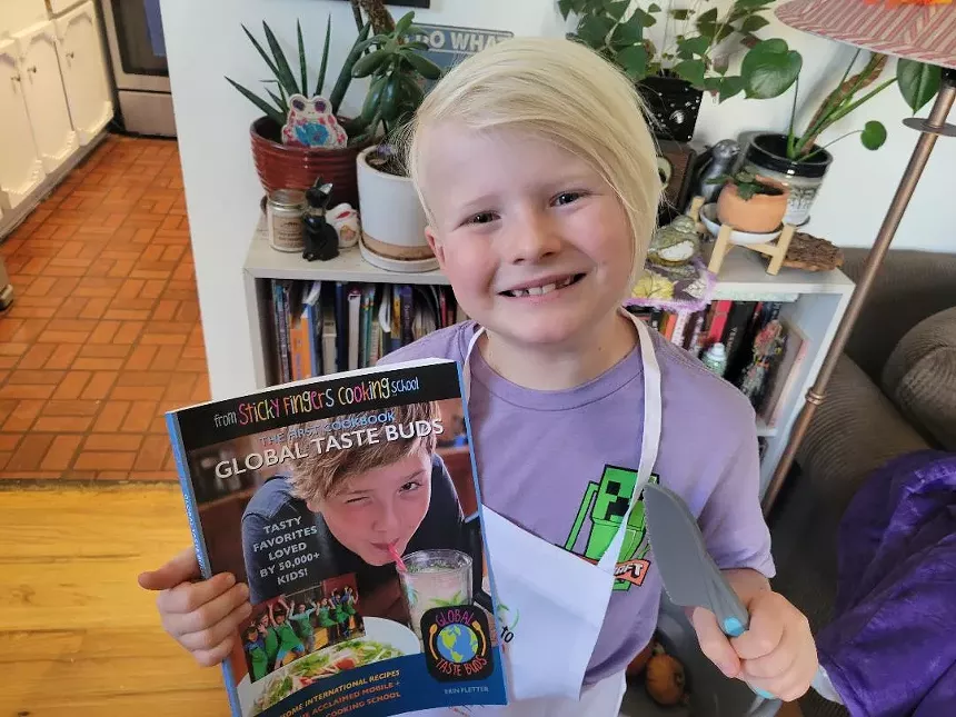 a kid holding a book