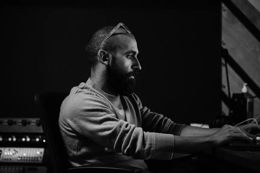 bearded man working at a computer