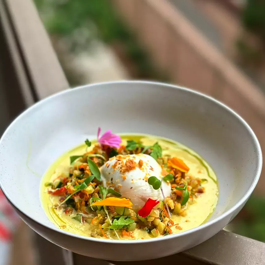 burrata on a plate with various garnishes