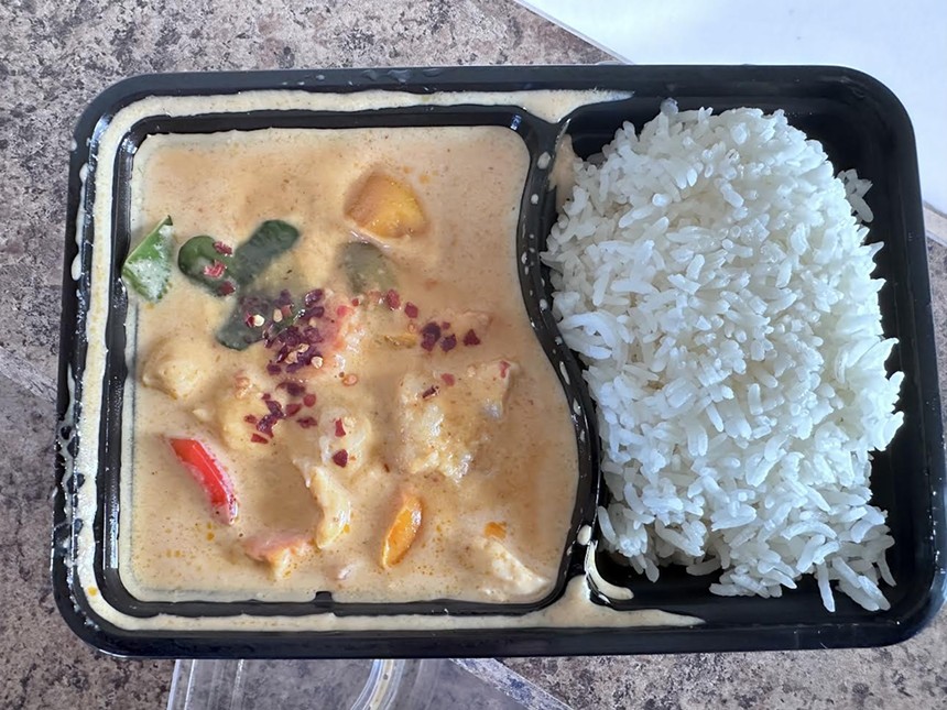 chicken curry and rice in a to go container