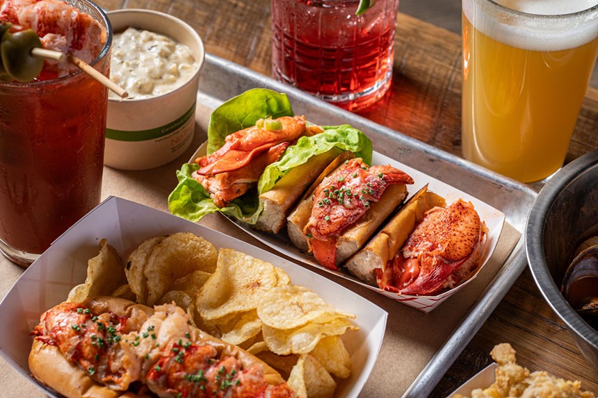 tin plate with lobster rolls and chips