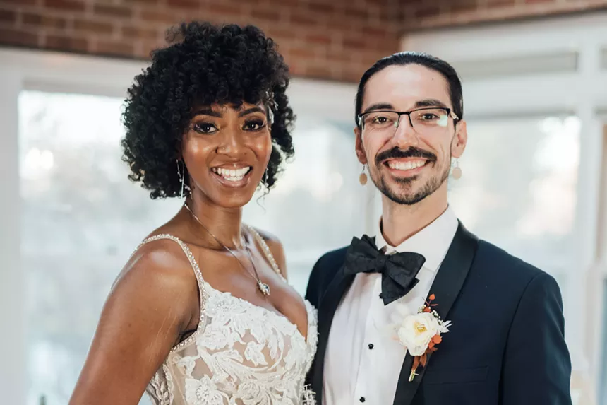 Lauren and Orion pose for wedding portraits in formal attire.