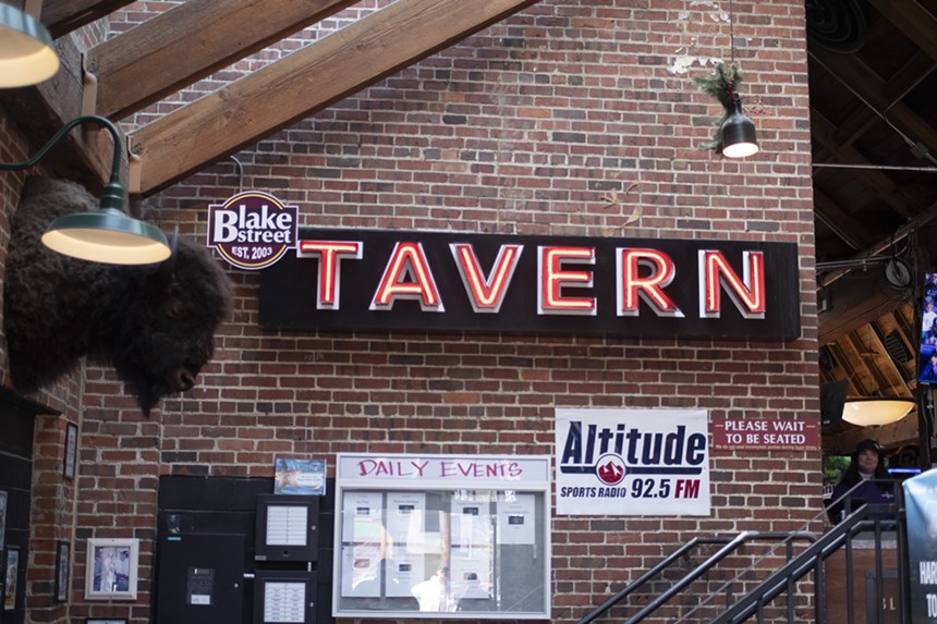 a "Tavern" sign inside a bar